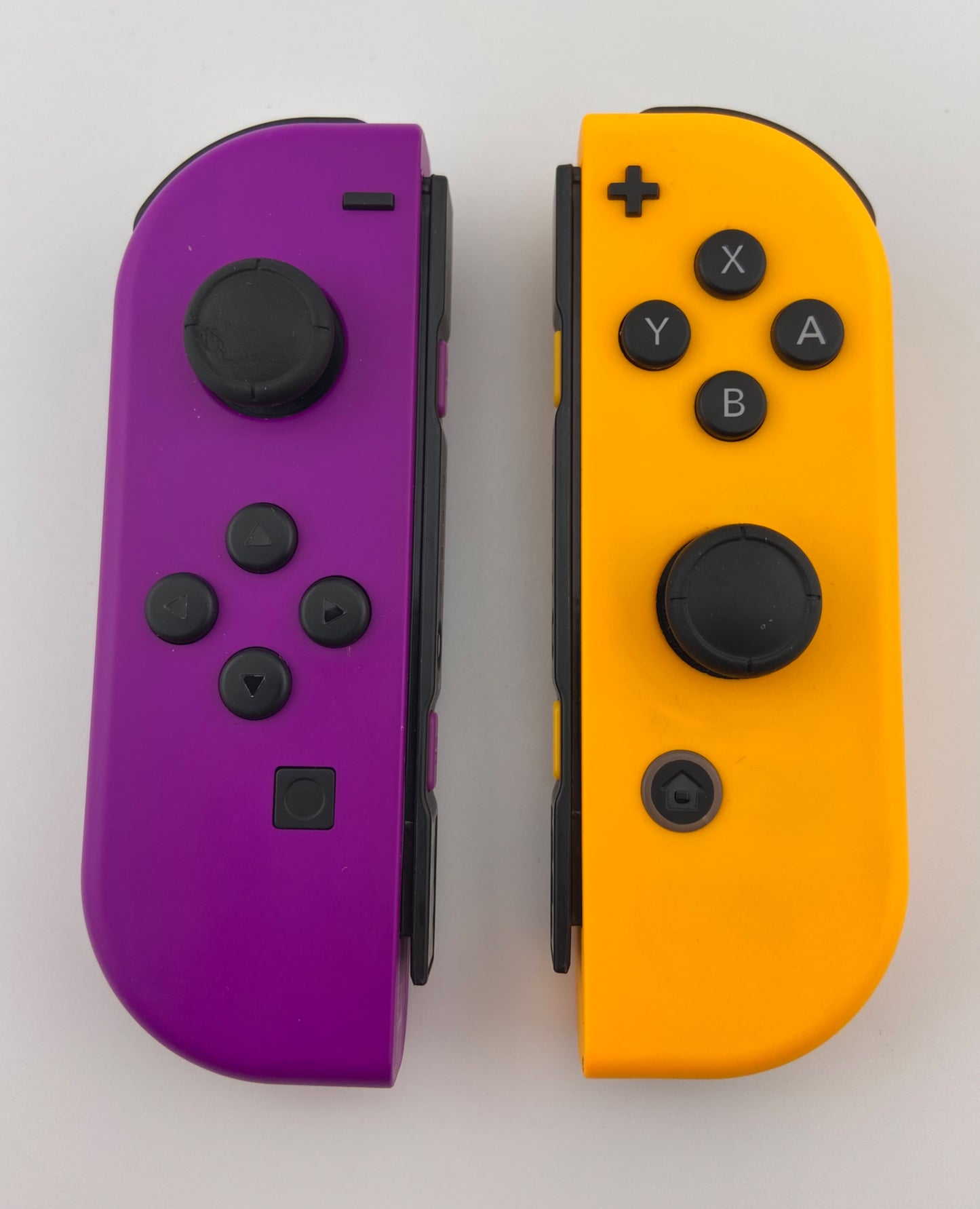 Neon Purple and Neon Orange Nintendo Switch Joy Con Controller Set Pair