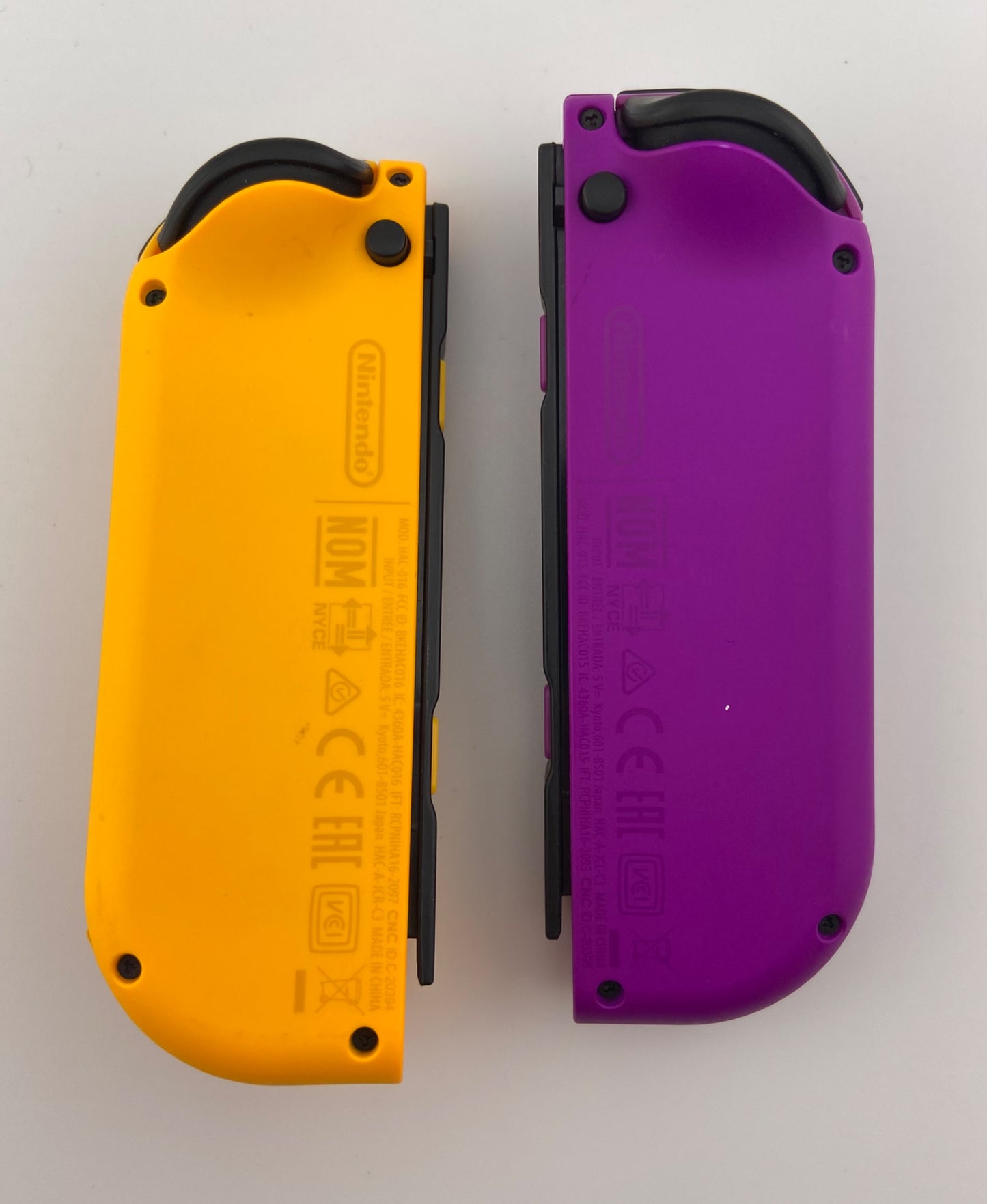 Neon Purple and Neon Orange Nintendo Switch Joy Con Controller Set Pair
