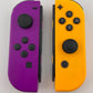 Neon Purple and Neon Orange Nintendo Switch Joy Con Controller Set Pair